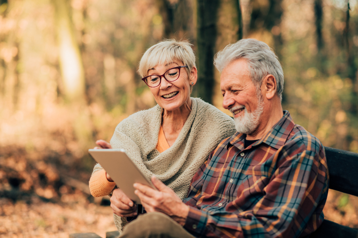 Elderly couple reviewing their land selling options